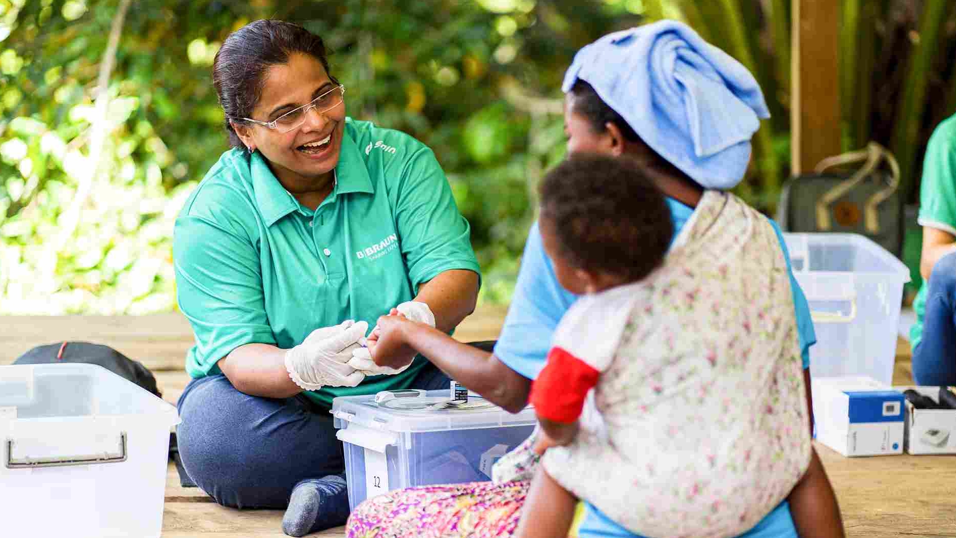 A medical laboratory employee is pouring liquid for a quality check.